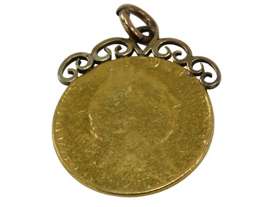 Lot 45 - A George III gold spade guinea, worn, in a...