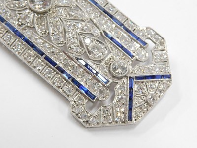 Lot 59 - An Art Deco diamond and sapphire panel brooch,...