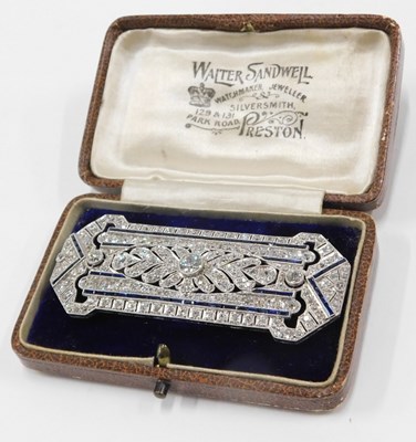 Lot 59 - An Art Deco diamond and sapphire panel brooch,...