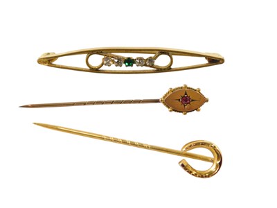 Lot 614 - A horseshoe tie pin, yellow metal, stamped 9ct,...