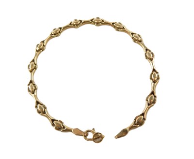 Lot 610 - A 9ct gold fancy link bracelet, on a lobster...