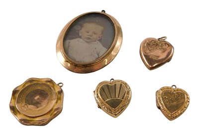 Lot 602 - Three gold plated heart shaped photo...