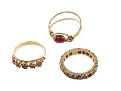 Lot 89 - A 9ct gold and garnet full eternity ring, one...