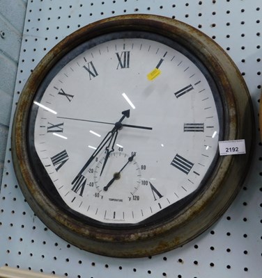 Lot 2192 - A metal cased wall clock, with Roman numerals,...