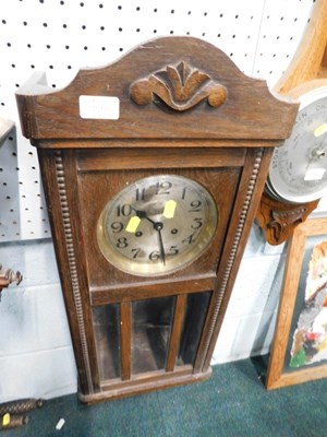Lot 2194 - An oak cased pendulum wall clock, with...