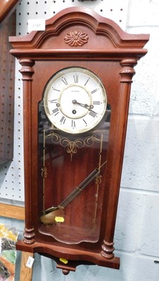Lot 2197 - A modern oak cased pendulum wall clock, with...