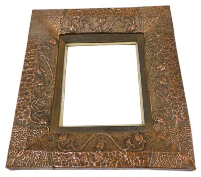 Lot 978 - A late 19th/early 20thC embossed and hammered...
