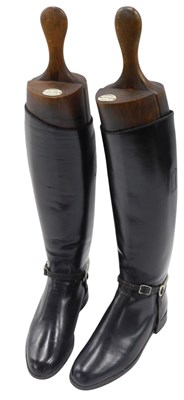 Lot 995 - A pair of black leather riding boots, the...