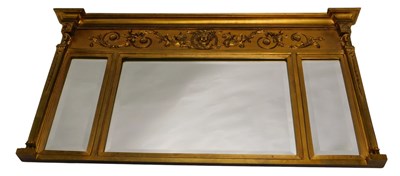 Lot 1051 - A gilt overmantel mirror, in Regency style,...