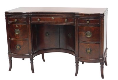 Lot 1064 - An early 20thC mahogany kneehole desk, the...
