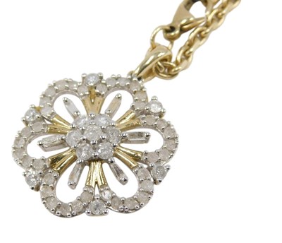 Lot 679 - A 9ct bicolour gold and diamond floral pendant,...
