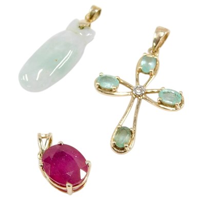 Lot 681 - A 9ct gold and gem set pendant cross, in an...
