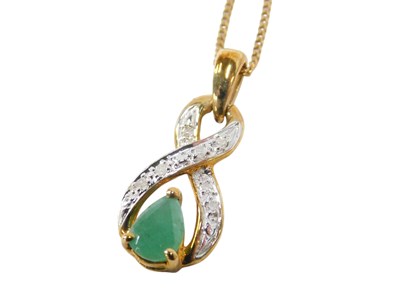 Lot 616 - A 9ct gold emerald and diamond pendant, in a...