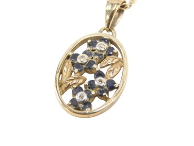 Lot 617 - A 9ct gold sapphire and diamond pendant, in an...