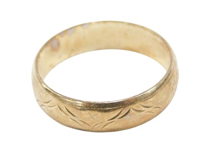 Lot 619 - A 9ct gold wedding band, with engraved...