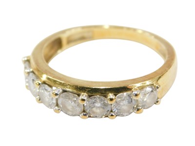Lot 618 - An 18ct gold and diamond seven stone ring, set...