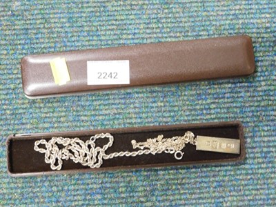 Lot 2242 - A silver ingot, hallmarked, on chain, together...