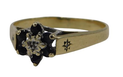 Lot 648 - A 9ct gold sapphire and diamond flower head...