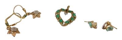 Lot 646 - A 9ct gold emerald and diamond heart shaped...