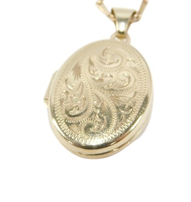 Lot 67 - A 9ct gold oval photo locket, with engraved...