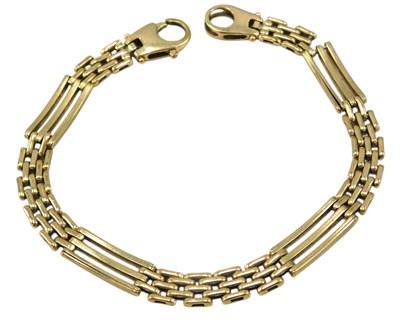 Lot 641 - A gate link bracelet, on a lobster claw clasp,...