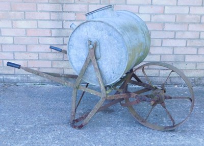 Lot 1210 - A galvanised metal water carrier, on a wrought...