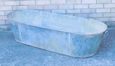 Lot 1217 - A galvanised metal twin handled wash tub,...