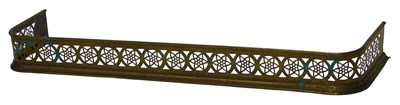 Lot 1099 - A Victorian pierced brass fender, 122cm wide.