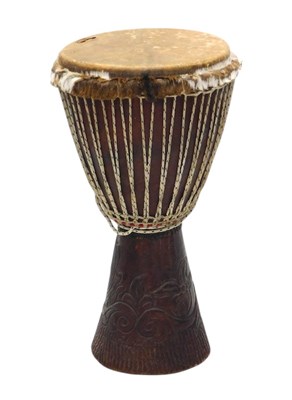 Lot 1104 - An African tribal drum, with animal skin to...