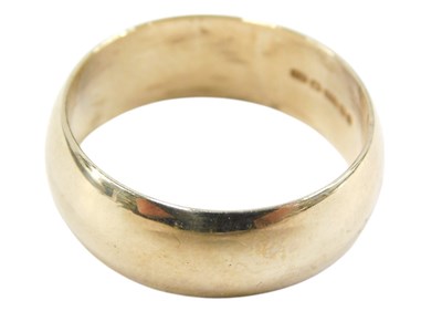 Lot 70 - A 9ct gold wide wedding band, size V, 7.1g.