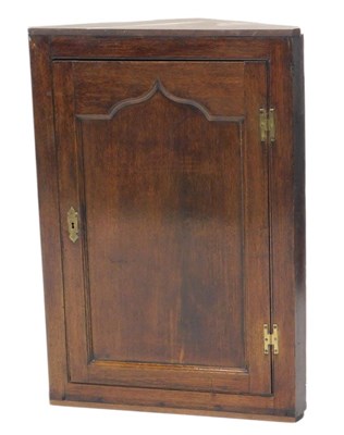Lot 1118 - A 18thC oak hanging corner cabinet, with a...