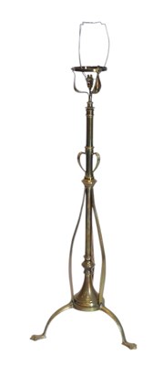 Lot 1128 - An Art Nouveau brass adjustable floor...