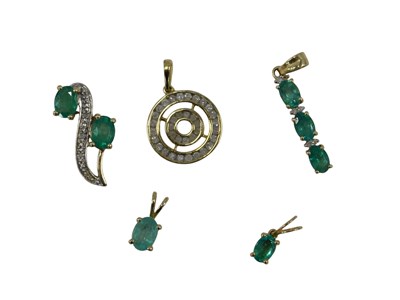 Lot 675 - A 9ct gold and diamond pendant of concentric...