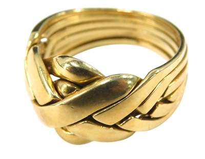 Lot 672 - A six piece puzzle ring, yellow metal, size...