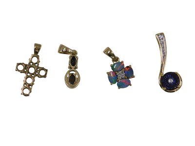 Lot 676 - A 9ct gold opal doublet and diamond set...
