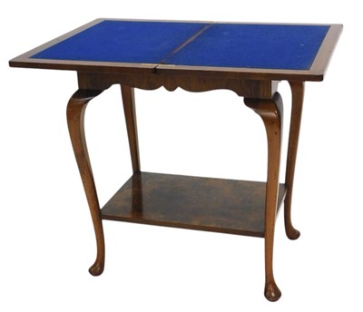 Lot 1151 - A figured walnut two tier card table, the...