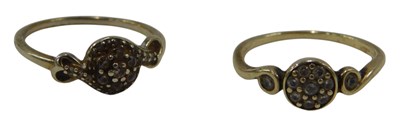 Lot 670a - A circular set 9ct and diamond flower head...