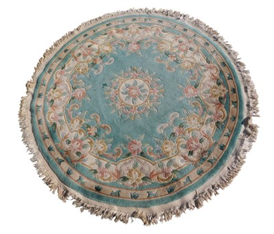 Lot 1167 - A large Chinese wool cut rug, decorated with...