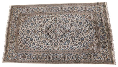 Lot 1168 - A Persian rug, with a design of scrolls,...