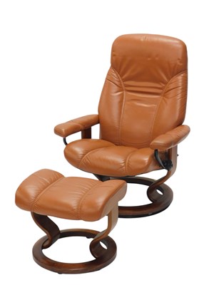 Lot 1189 - A Stressless brown leather armchair, with stool.
