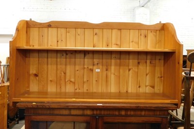 Lot 1537 - A pine wall hanging shelf, 70cm high, 140cm...