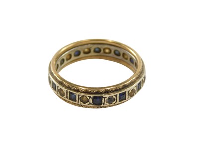 Lot 98 - A sapphire and diamond bicolour eternity...