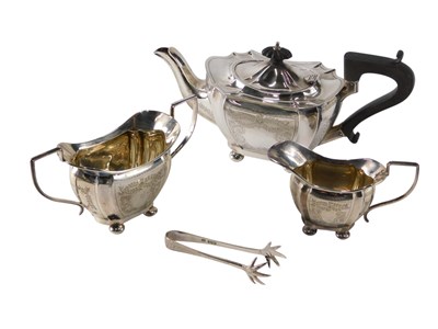 Lot 298 - A George V associated silver three piece tea...