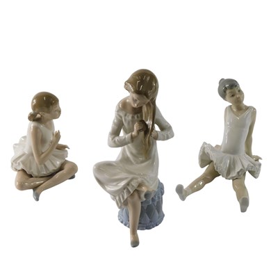 Lot 857 - A Nao porcelain figure of a seated...