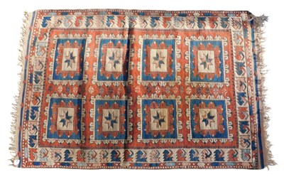 Lot 1088 - A Turkish rug, with a design of geometric...