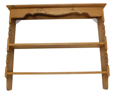 Lot 1097 - A pine tow tier wall mounted plate rack, with...