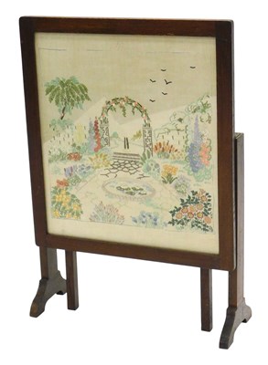 Lot 1138 - A 1920s oak fire screen table, inset with a...