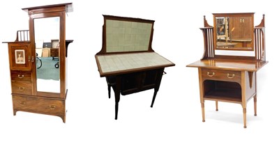 Lot 1201 - An Edwardian mahogany bedroom suite by James...