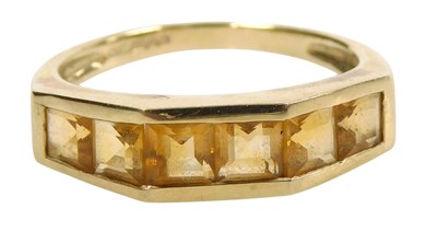 Lot 568 - A 9ct gold and citrine six stone ring, in a...