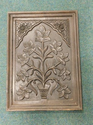 Lot 2299 - A resin plaque, made to simulate carved wood,...